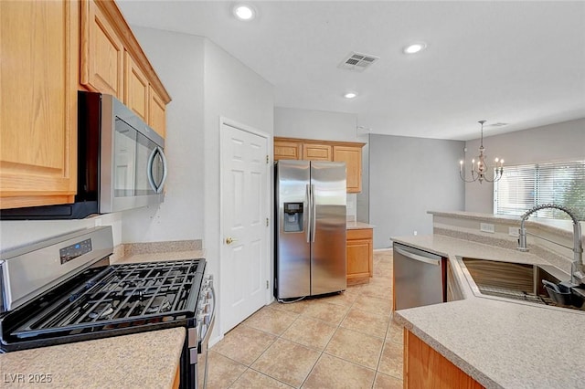 1574 Ward Frontier Ln, Henderson, NV 89002 - kitchen featuring appliances with stainless steel finishes, a sink, a chandelier, light countertops, and recessed lighting