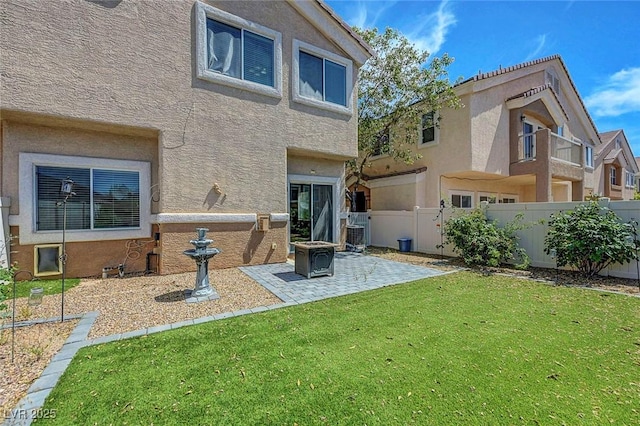 1574 Ward Frontier Ln, Henderson, NV 89002 - back of property with stucco siding and a patio area
