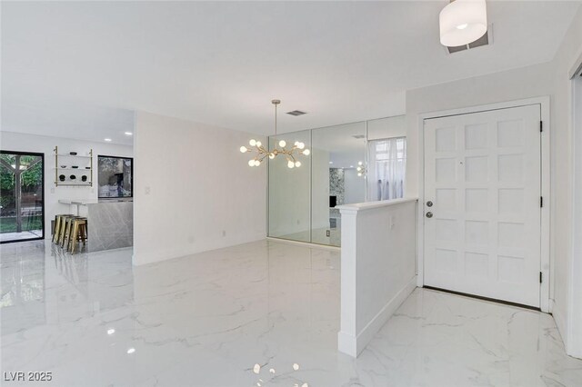 3013 Plaza De Rosa, Las Vegas, NV 89102 - foyer with a chandelier, light marble finish flooring, and baseboards