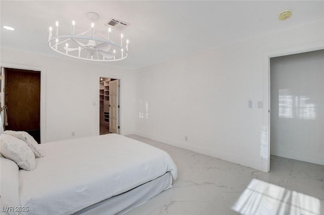 3013 Plaza De Rosa, Las Vegas, NV 89102 - bedroom featuring a chandelier, a spacious closet, marble finish floors, and baseboards