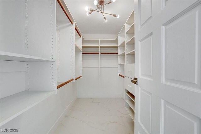 3013 Plaza De Rosa, Las Vegas, NV 89102 - spacious closet featuring marble finish flooring and a chandelier
