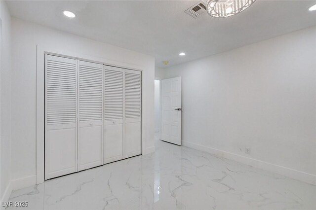 3013 Plaza De Rosa, Las Vegas, NV 89102 - unfurnished bedroom with marble finish flooring, recessed lighting, baseboards, and a closet