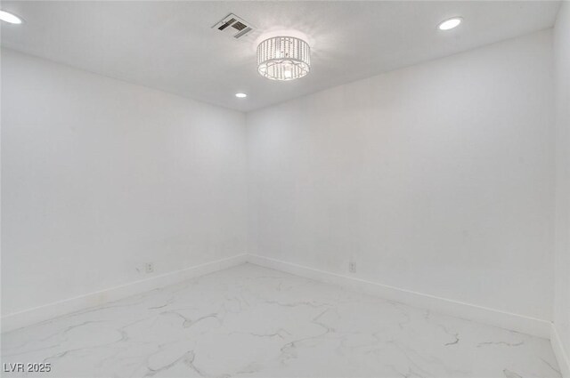 3013 Plaza De Rosa, Las Vegas, NV 89102 - spare room featuring light marble finish floors, baseboards, recessed lighting, and a chandelier