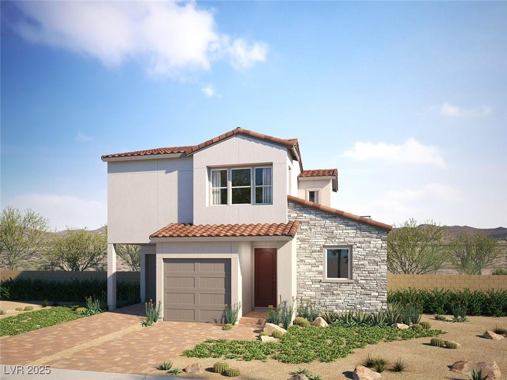 1808 Mangrove Ct, Las Vegas, NV 89138 - mediterranean / spanish house with a tiled roof, decorative driveway, stucco siding, and an attached garage