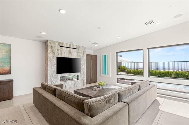 826 Bolide St, Las Vegas, NV 89138 - living room featuring light tile patterned flooring, recessed lighting, and baseboards