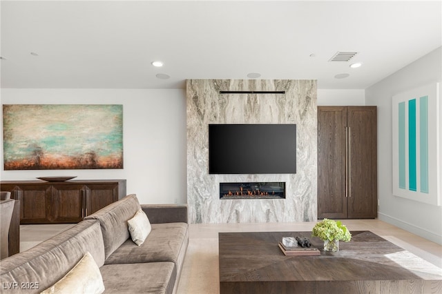 826 Bolide St, Las Vegas, NV 89138 - living area featuring a premium fireplace and baseboards