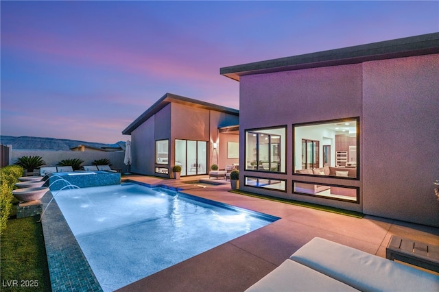826 Bolide St, Las Vegas, NV 89138 - view of swimming pool with a patio, a fenced backyard, and a pool with connected hot tub