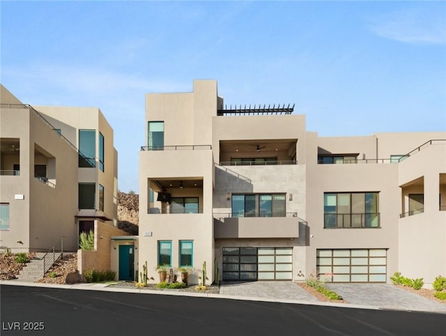 358 Solitude Peak Ln, Henderson, NV 89012 - view of apartment building / complex with a garage and driveway