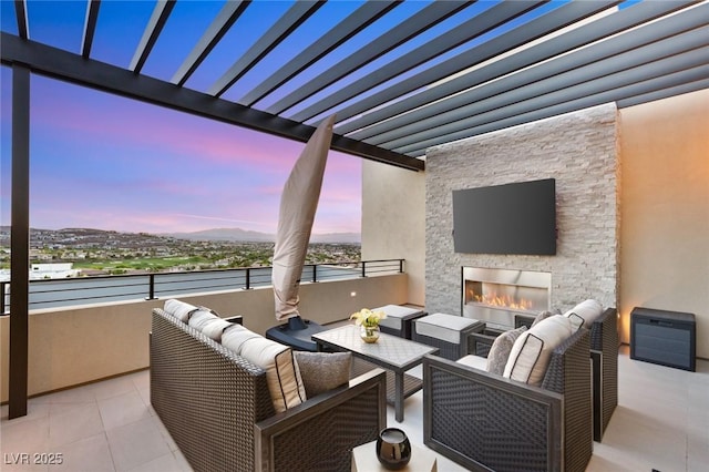 358 Solitude Peak Ln, Henderson, NV 89012 - view of patio / terrace featuring an outdoor living space with a fireplace