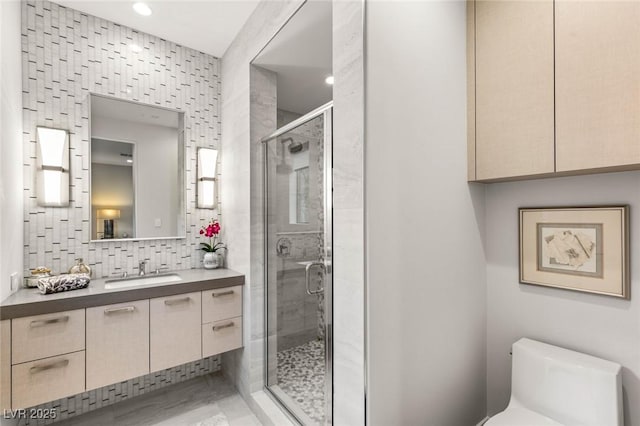 358 Solitude Peak Ln, Henderson, NV 89012 - bathroom with vanity, toilet, a shower stall, decorative backsplash, and recessed lighting