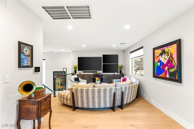 358 Solitude Peak Ln, Henderson, NV 89012 - living room with light wood finished floors, recessed lighting, and baseboards