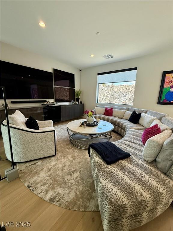 358 Solitude Peak Ln, Henderson, NV 89012 - living area featuring wood finished floors and recessed lighting
