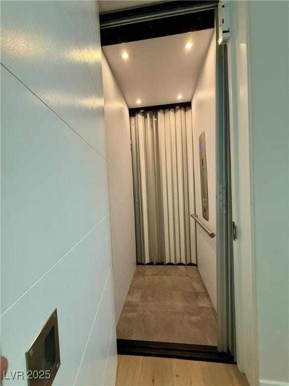358 Solitude Peak Ln, Henderson, NV 89012 - hall with elevator and recessed lighting