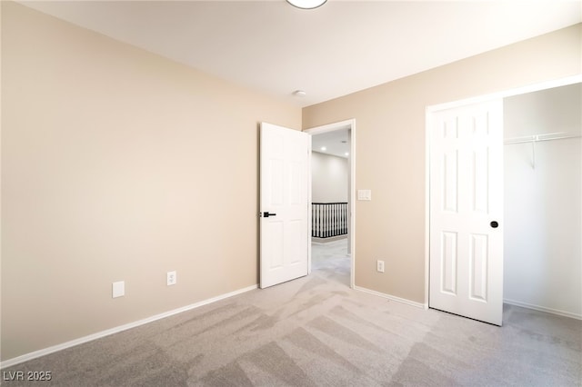 6260 Castle Kennedy St, Henderson, NV 89011 - unfurnished bedroom with light carpet, baseboards, and a closet