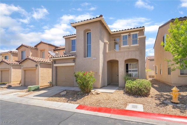 6260 Castle Kennedy St, Henderson, NV 89011 - mediterranean / spanish house with a balcony, stucco siding, a tile roof, concrete driveway, and a garage