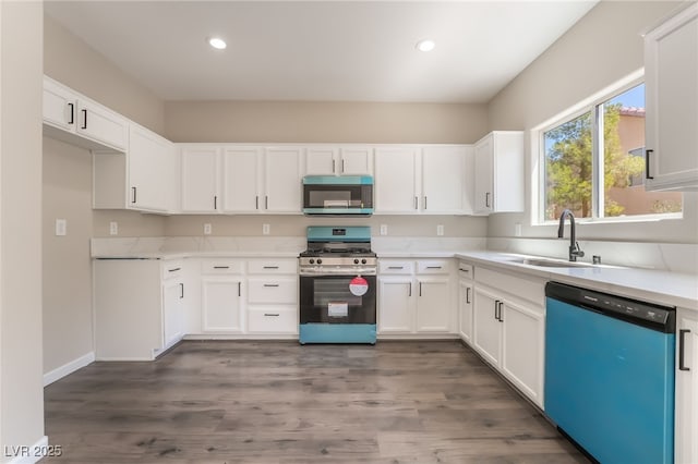 6260 Castle Kennedy St, Henderson, NV 89011 - kitchen featuring appliances with stainless steel finishes, a sink, recessed lighting, light countertops, and white cabinets