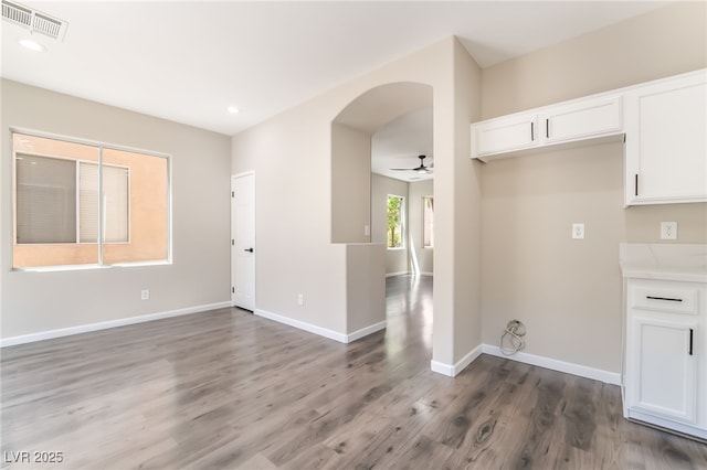 6260 Castle Kennedy St, Henderson, NV 89011 - unfurnished room featuring arched walkways, wood finished floors, baseboards, a ceiling fan, and recessed lighting
