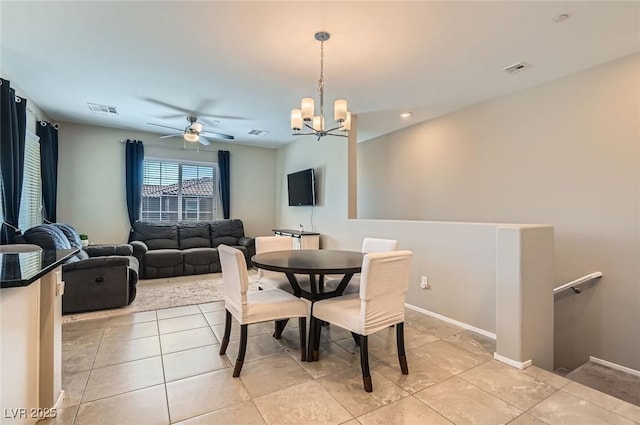 8490 Classique Ave Unit 101, Las Vegas, NV 89178 - dining space featuring a chandelier, light tile patterned floors, a ceiling fan, and baseboards