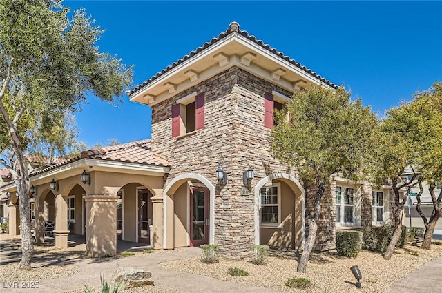 8490 Classique Ave Unit 101, Las Vegas, NV 89178 - view of front of property with a tile roof and stucco siding