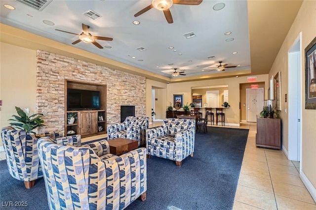 8490 Classique Ave Unit 101, Las Vegas, NV 89178 - living area featuring ceiling fan, light tile patterned flooring, recessed lighting, a raised ceiling, and baseboards