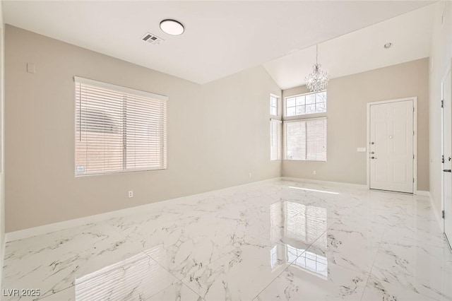 216 Sharp Edge Ave, North Las Vegas, NV 89031 - unfurnished room with a chandelier, marble finish flooring, and baseboards