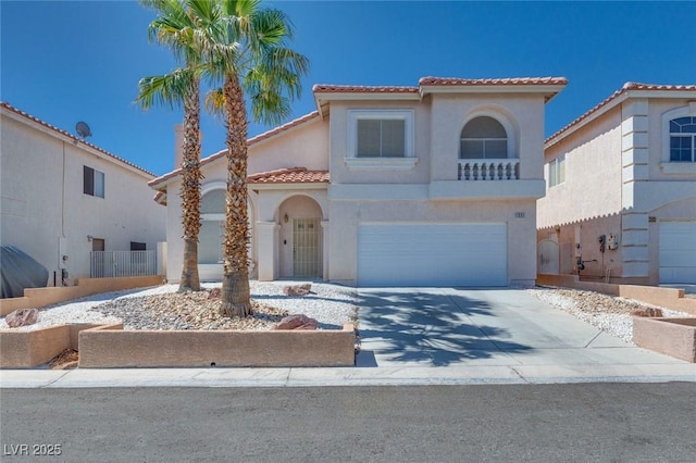 1551 Echo Falls Ave, Las Vegas, NV 89183 - mediterranean / spanish home featuring a tiled roof, stucco siding, concrete driveway, and an attached garage