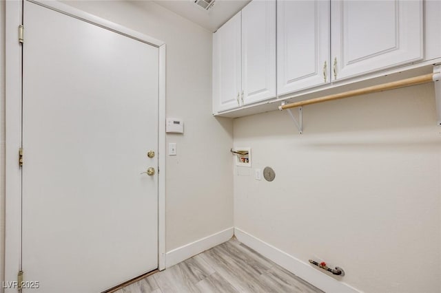 1551 Echo Falls Ave, Las Vegas, NV 89183 - washroom featuring hookup for a gas dryer, baseboards, hookup for a washing machine, cabinet space, and light wood-style flooring