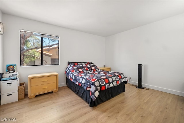 3151 Soaring Gulls Dr Unit 2121, Las Vegas, NV 89128 - bedroom featuring light wood finished floors and baseboards