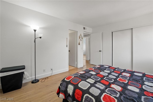 3151 Soaring Gulls Dr Unit 2121, Las Vegas, NV 89128 - bedroom with light wood-style flooring, a closet, and baseboards