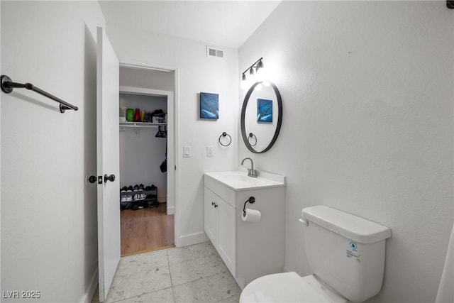 3151 Soaring Gulls Dr Unit 2121, Las Vegas, NV 89128 - bathroom featuring vanity, toilet, baseboards, and tile patterned flooring