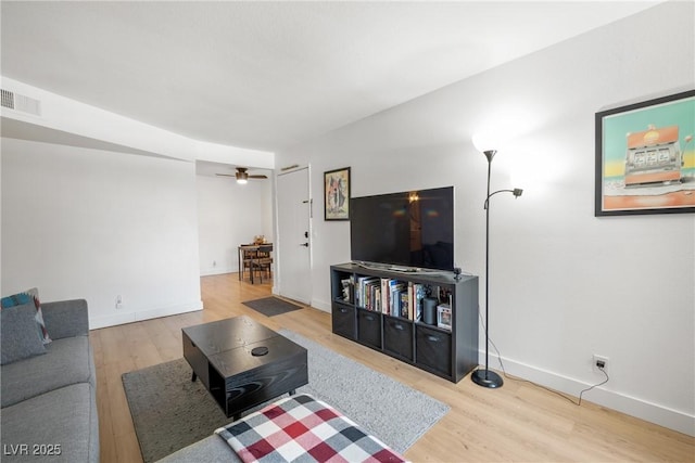 3151 Soaring Gulls Dr Unit 2121, Las Vegas, NV 89128 - living area with wood finished floors, baseboards, and a ceiling fan