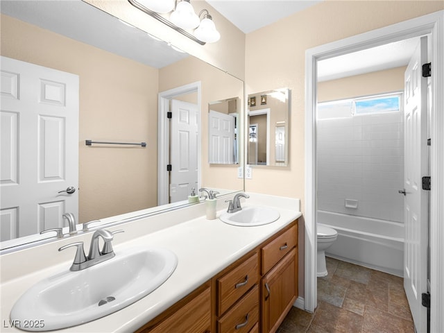 10612 Gum Tree Ct, Las Vegas, NV 89144 - bathroom with toilet, double vanity, stone finish flooring, and bathing tub / shower combination
