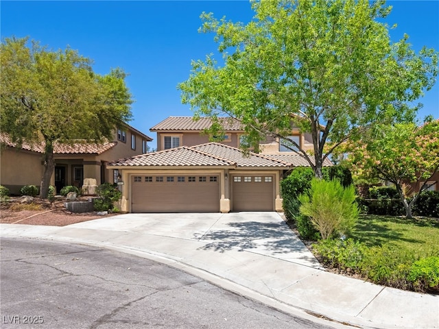 10612 Gum Tree Ct, Las Vegas, NV 89144 - mediterranean / spanish-style home featuring stucco siding, an attached garage, concrete driveway, and a tiled roof