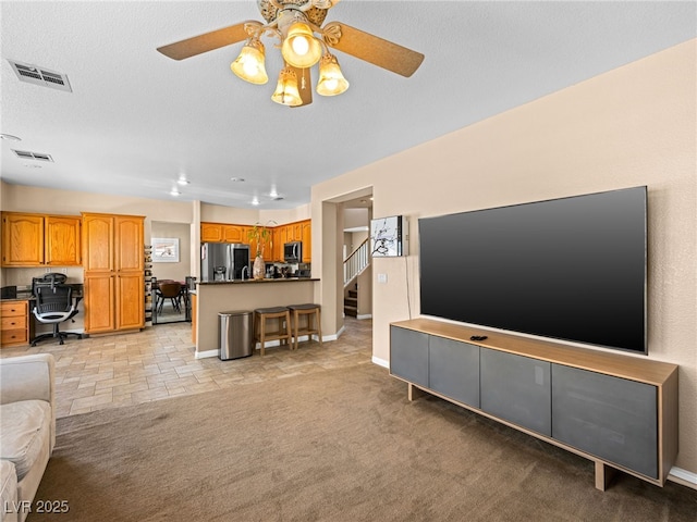 10612 Gum Tree Ct, Las Vegas, NV 89144 - living area featuring ceiling fan, baseboards, a desk, and stairs