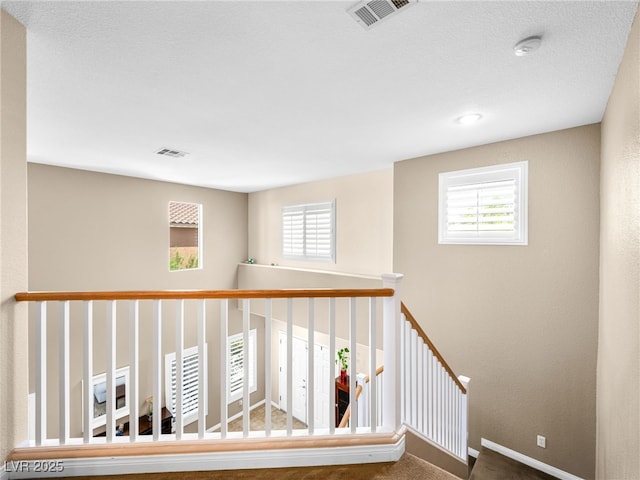 10612 Gum Tree Ct, Las Vegas, NV 89144 - hallway with plenty of natural light, carpet floors, baseboards, and an upstairs landing