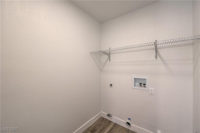 2117 Desert Peak Rd, Las Vegas, NV 89134 - washroom featuring baseboards, electric dryer hookup, gas dryer hookup, washer hookup, and wood finished floors