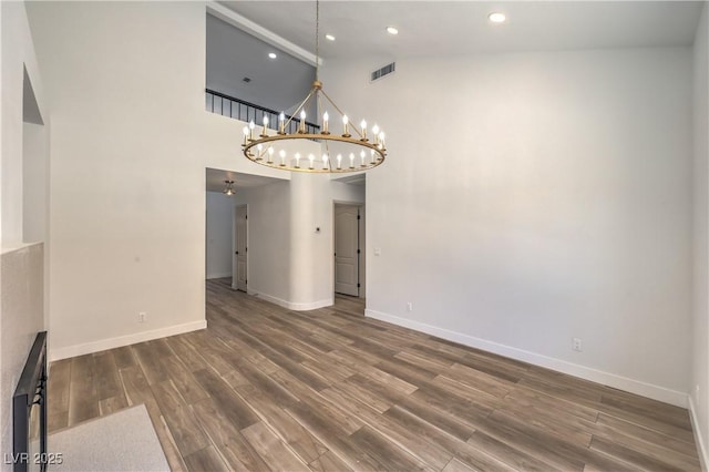 2117 Desert Peak Rd, Las Vegas, NV 89134 - unfurnished dining area with high vaulted ceiling, a chandelier, dark wood-style floors, and recessed lighting