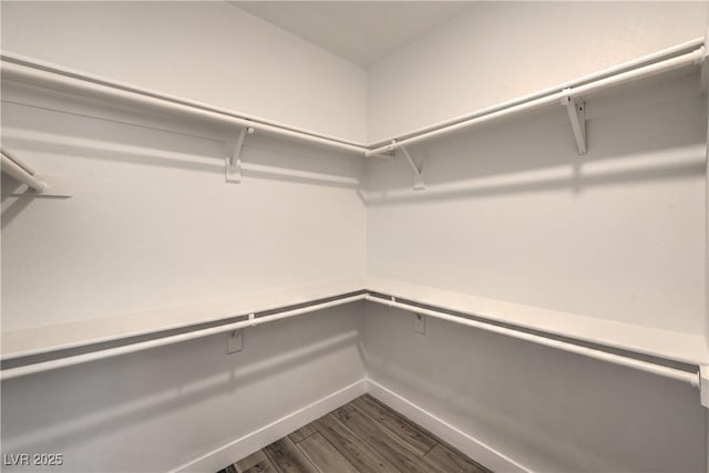 2117 Desert Peak Rd, Las Vegas, NV 89134 - spacious closet featuring dark wood-style floors