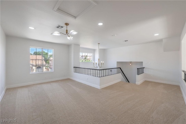 2117 Desert Peak Rd, Las Vegas, NV 89134 - empty room featuring a chandelier, light carpet, baseboards, and recessed lighting