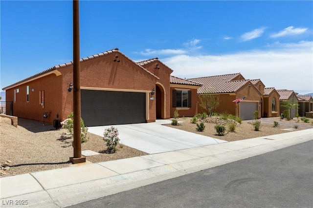 1398 Pin Cushion Rdg, Mesquite, NV 89034 - view of front of house featuring a garage, a tiled roof, driveway, and stucco siding
