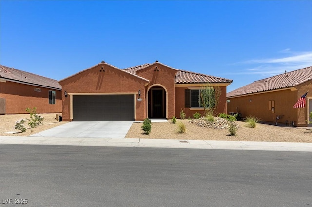 1398 Pin Cushion Rdg, Mesquite, NV 89034 - mediterranean / spanish home with a garage, a tile roof, concrete driveway, and stucco siding
