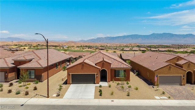 1398 Pin Cushion Rdg, Mesquite, NV 89034 - view of front facade featuring an attached garage, driveway, stucco siding, and a residential view