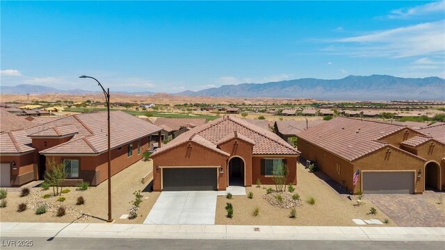 1398 Pin Cushion Rdg, Mesquite, NV 89034 - view of front facade featuring an attached garage, driveway, stucco siding, and a residential view