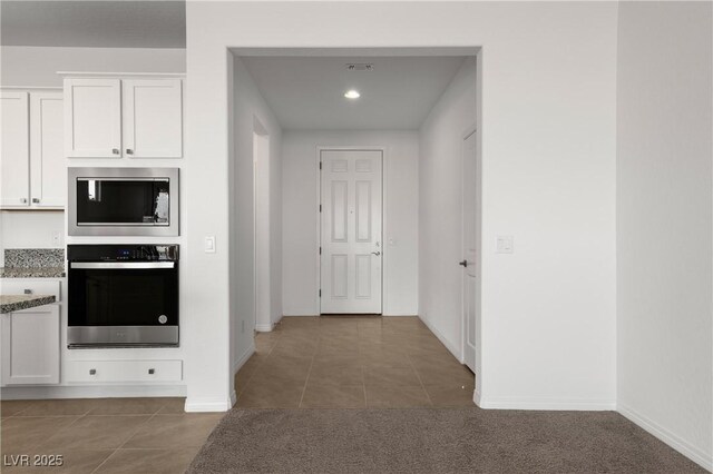 1398 Pin Cushion Rdg, Mesquite, NV 89034 - kitchen with appliances with stainless steel finishes, tile patterned floors, white cabinetry, light stone countertops, and recessed lighting