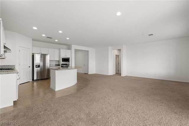 1398 Pin Cushion Rdg, Mesquite, NV 89034 - kitchen with stainless steel appliances, recessed lighting, white cabinets, a center island with sink, and open floor plan