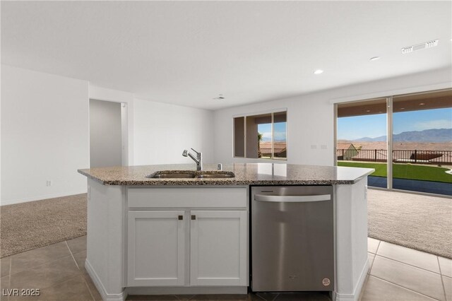1398 Pin Cushion Rdg, Mesquite, NV 89034 - kitchen featuring stainless steel dishwasher, light colored carpet, open floor plan, light tile patterned flooring, and recessed lighting