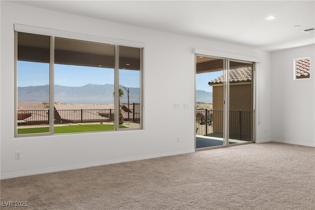 1398 Pin Cushion Rdg, Mesquite, NV 89034 - empty room with a mountain view, carpet flooring, and recessed lighting