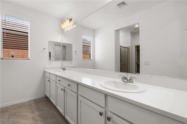 1398 Pin Cushion Rdg, Mesquite, NV 89034 - full bath featuring double vanity, an enclosed shower, and tile patterned floors