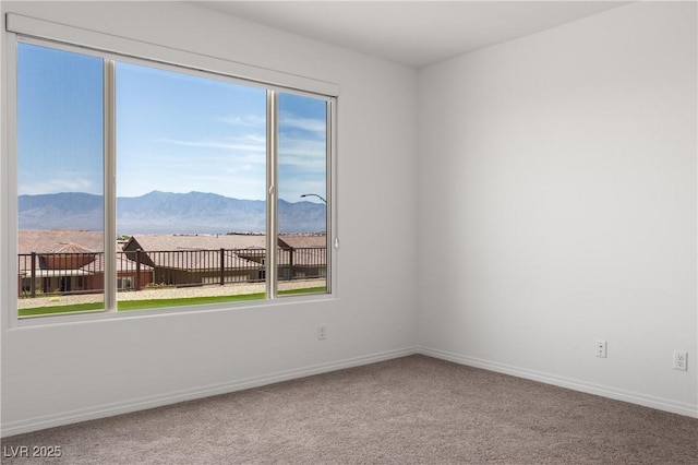 1398 Pin Cushion Rdg, Mesquite, NV 89034 - empty room featuring a mountain view and carpet flooring