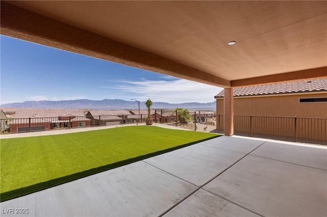 1398 Pin Cushion Rdg, Mesquite, NV 89034 - fenced backyard featuring a mountain view and a patio area